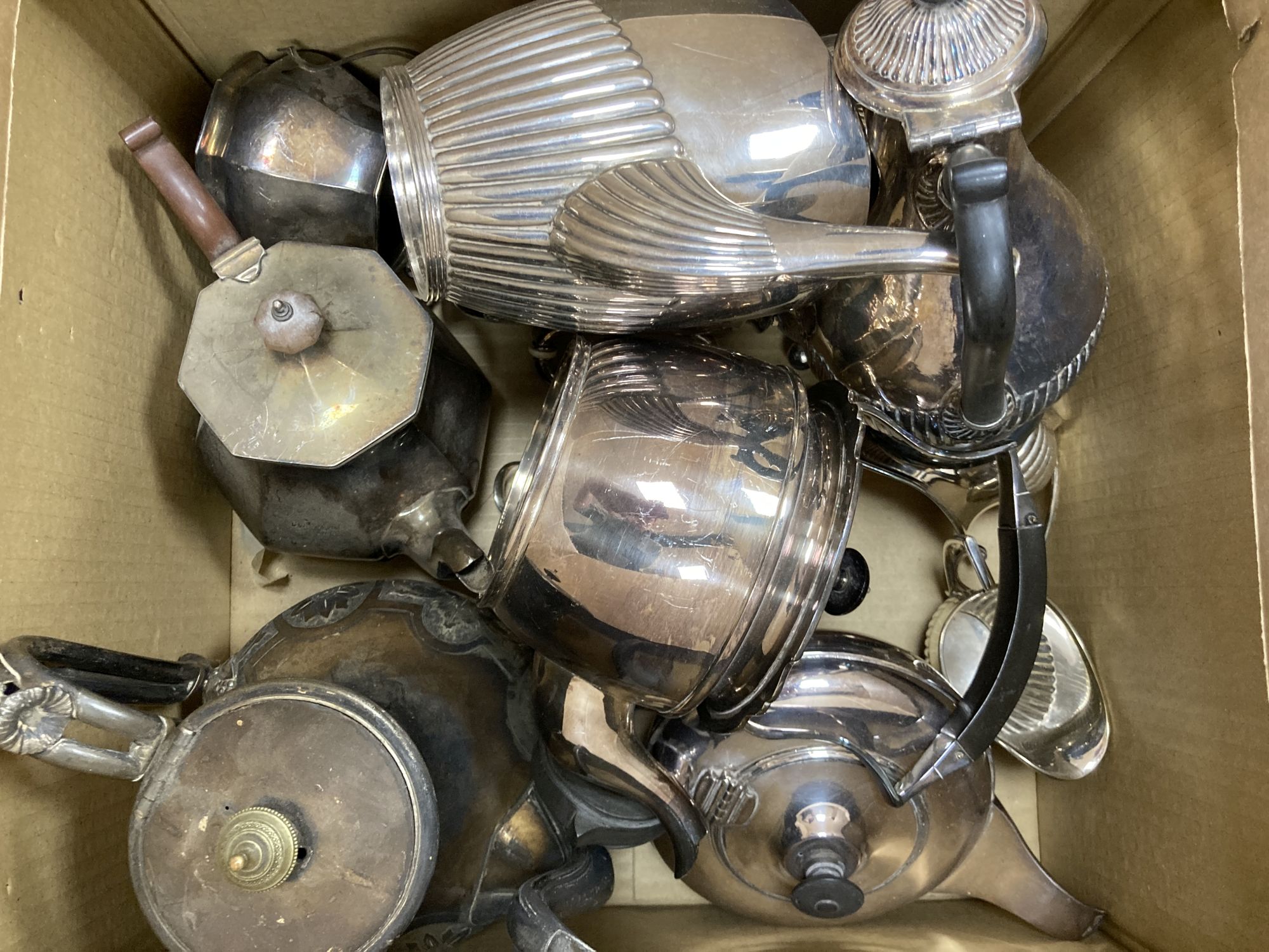 A quantity of assorted plated tea ware including teapots, tea kettle, coffee pot, etc.